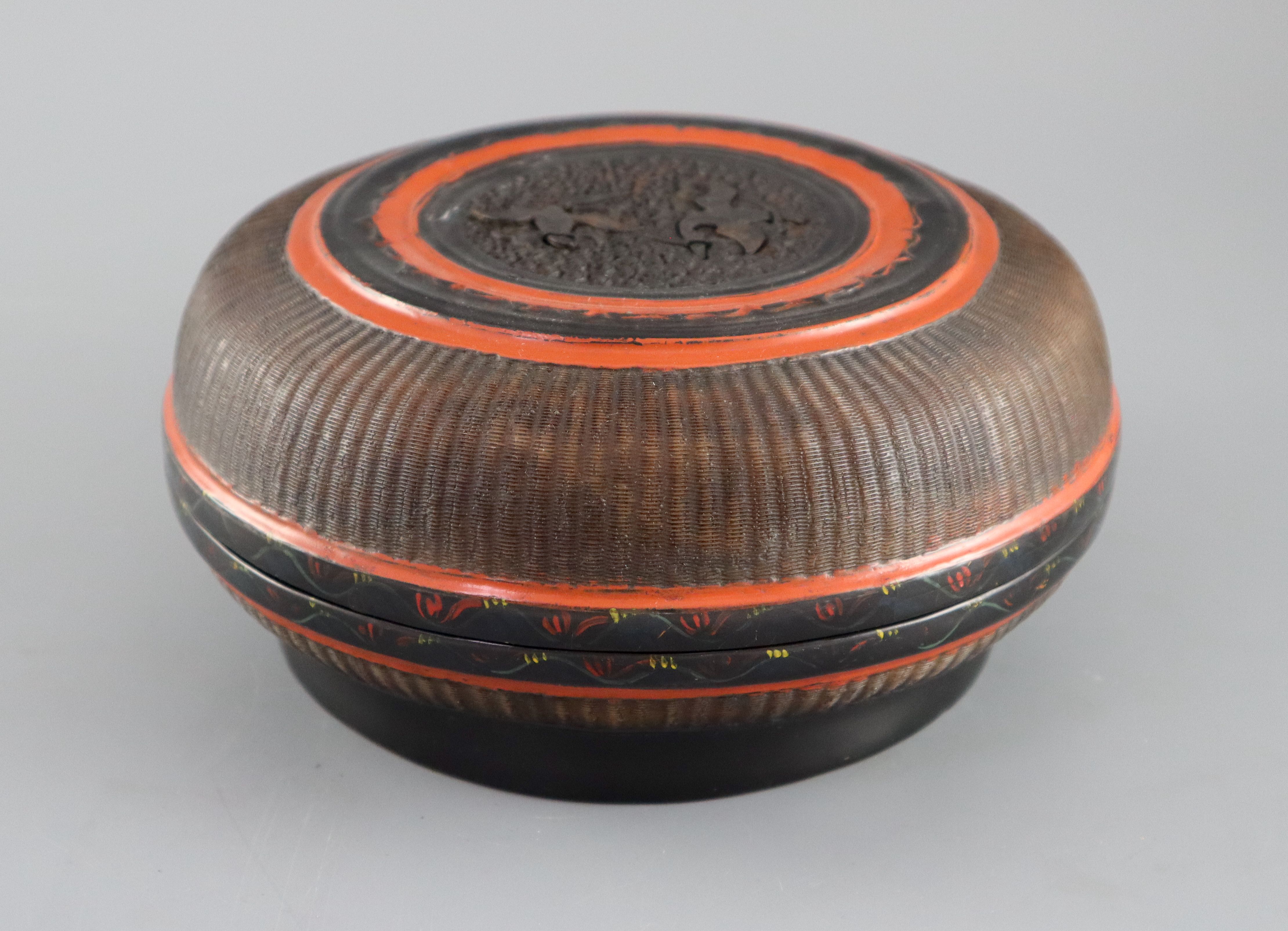 A Southern Chinese lacquer and basket weave box, 18th/19th century, with carved tortoiseshell roundel to the cover, 20.5cm diameter